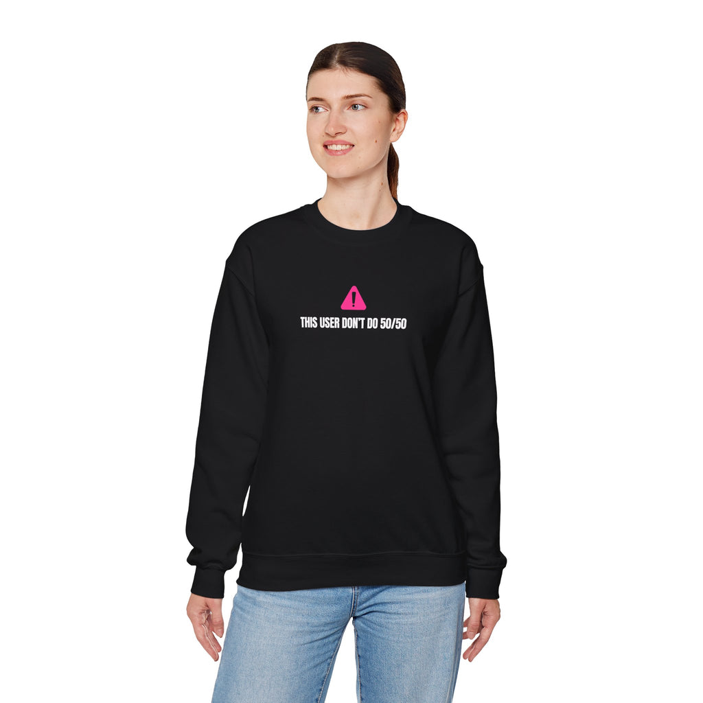Person wearing a black sweatshirt that says This user don’t do 50/50 sweatshirt - with a pink triangle and text on a white background
